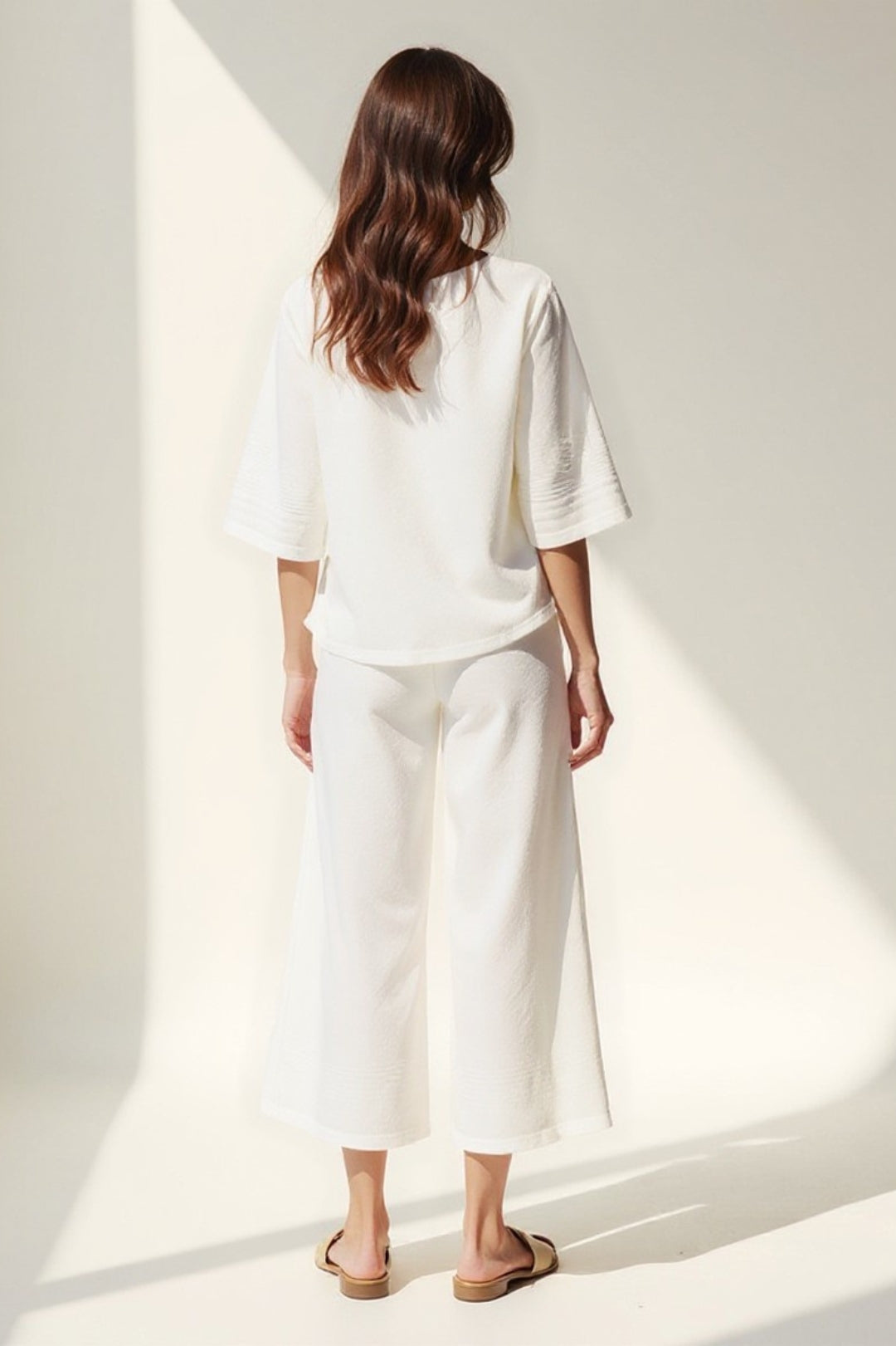 Completo due pezzi con bottoni decorativi | Maglia a maniche 3/4 e pantaloni culotte