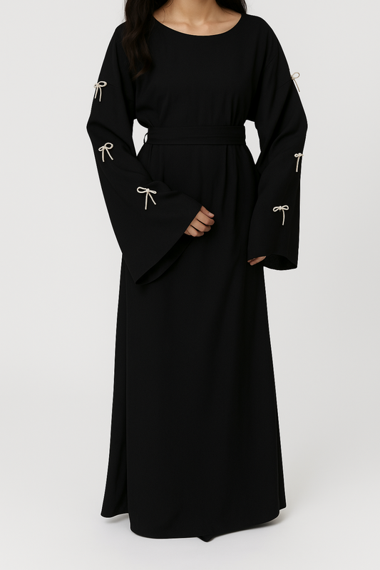 Abaya nera con maniche a campana e fiocchi decorativi