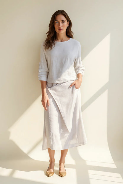Completo con maglia a maniche lunghe e gonna midi asimmetrica | Eleganza semplice e naturale
