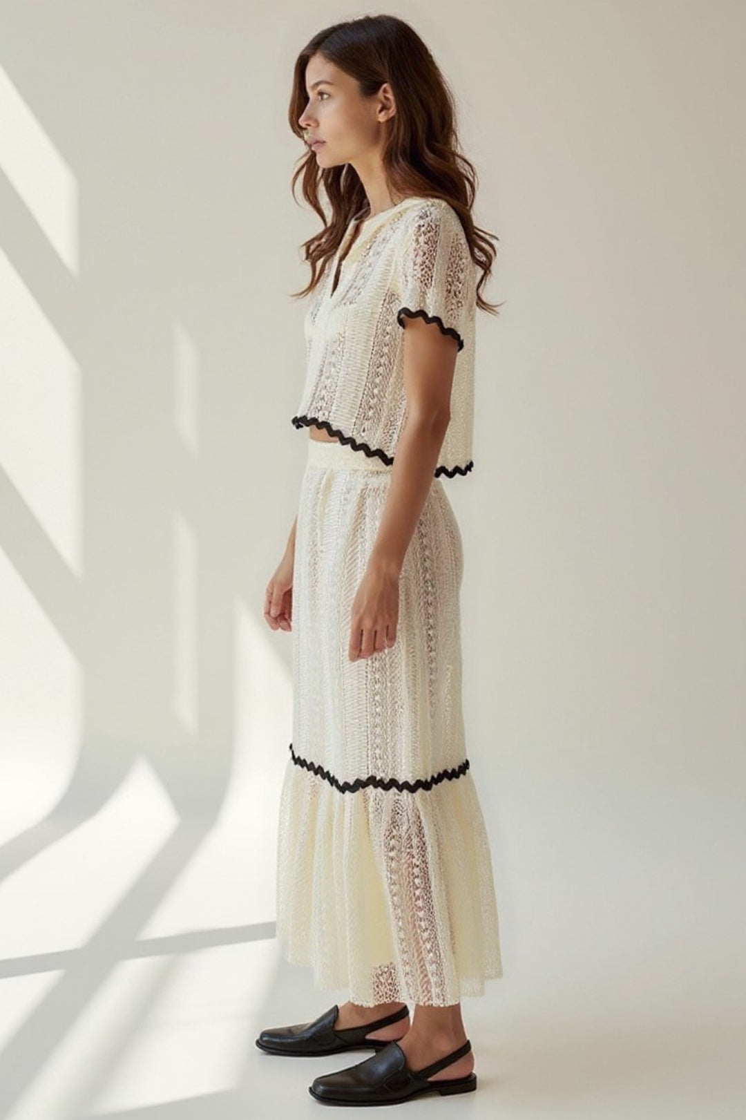 Completo due pezzi in pizzo con top e gonna lunga