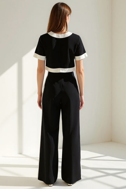 Completo elegante bicolore con giacca corta e pantaloni a gamba larga