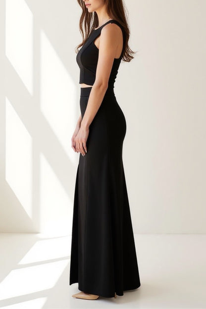 Completo elegante due pezzi nero con top aderente e gonna lunga con spacco | Look sofisticato per serate speciali