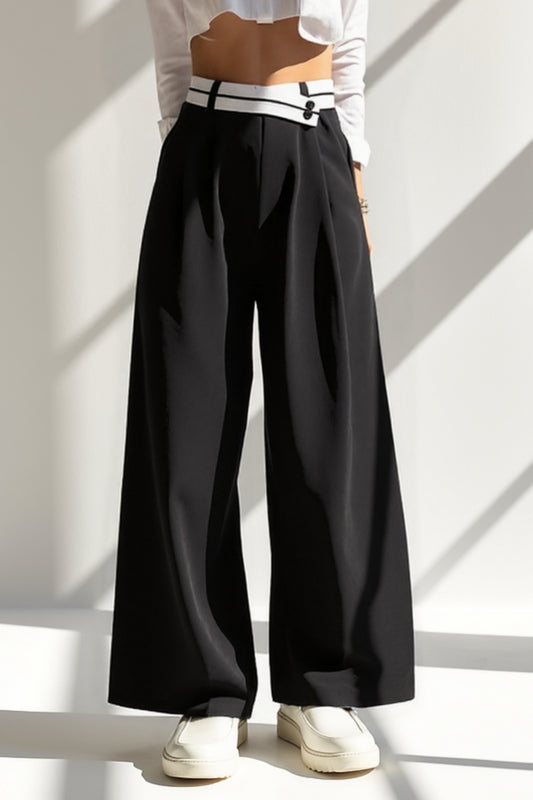 Pantalone nero a gamba larga con vita alta bicolore | Dettaglio con bottoni decorativi