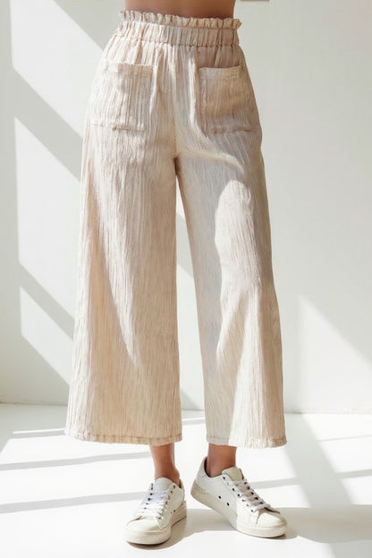 Pantaloni ampi in tessuto goffrato | Vita alta elasticizzata | Design leggero e arioso