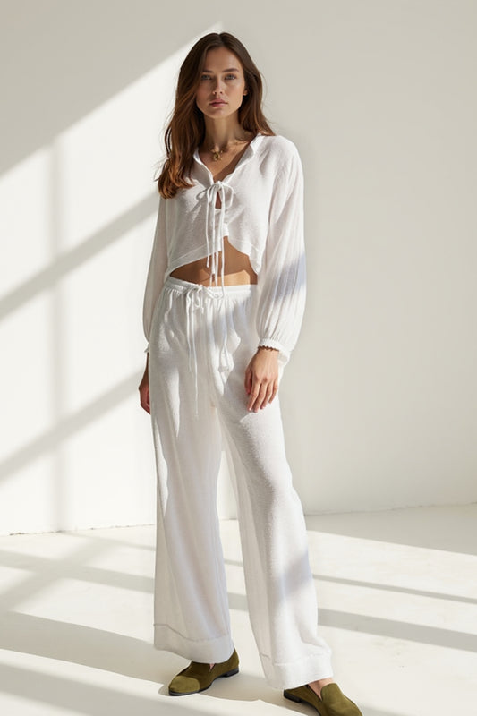 Set coordinata in tessuto leggero | Top con nodo e pantaloni larghi